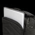 A silver laptop is partially tucked into the front compartment of the Condor Prime Pack 21L - MultiCam Black backpack.